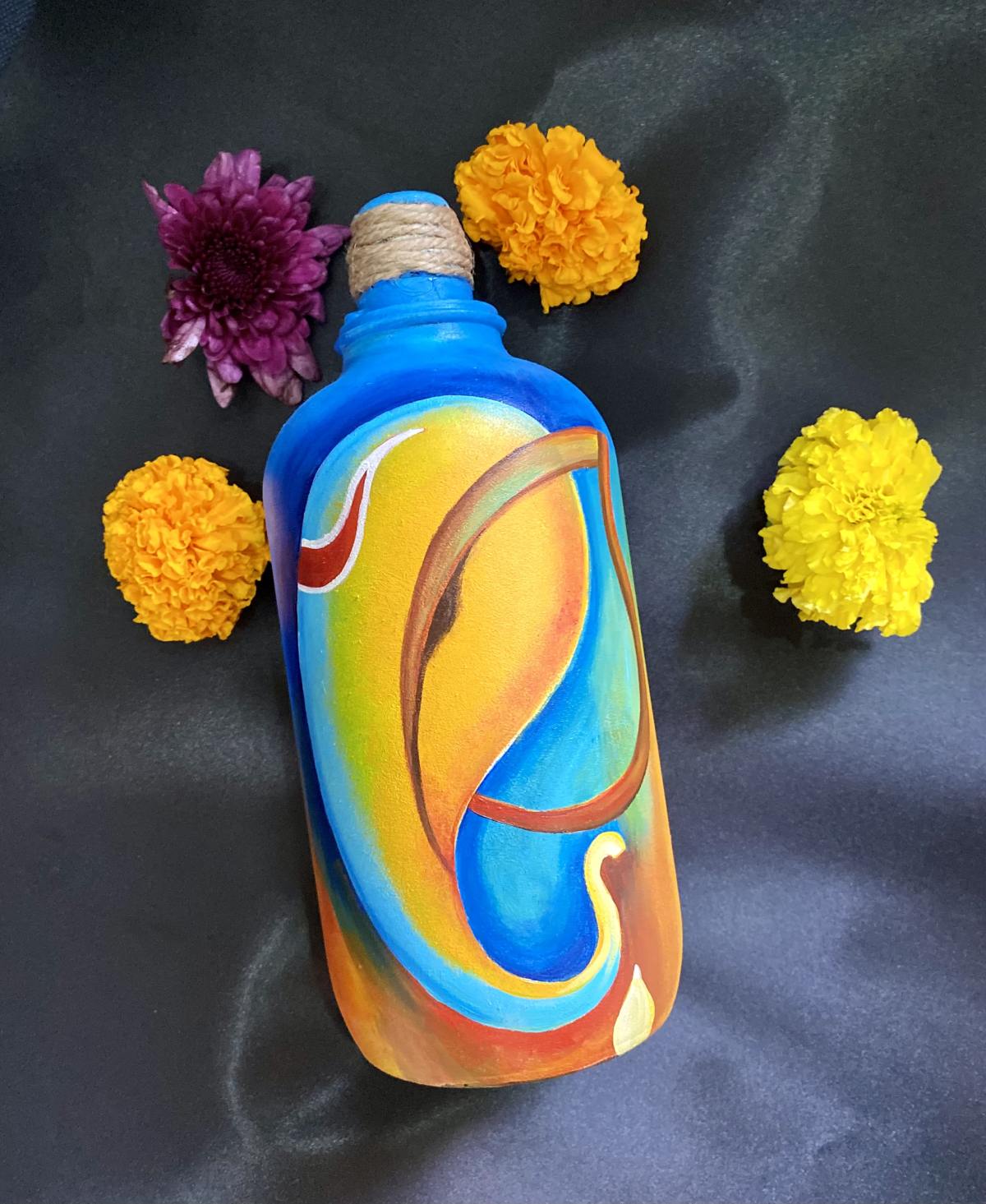 A water bottle decorated with glass paint